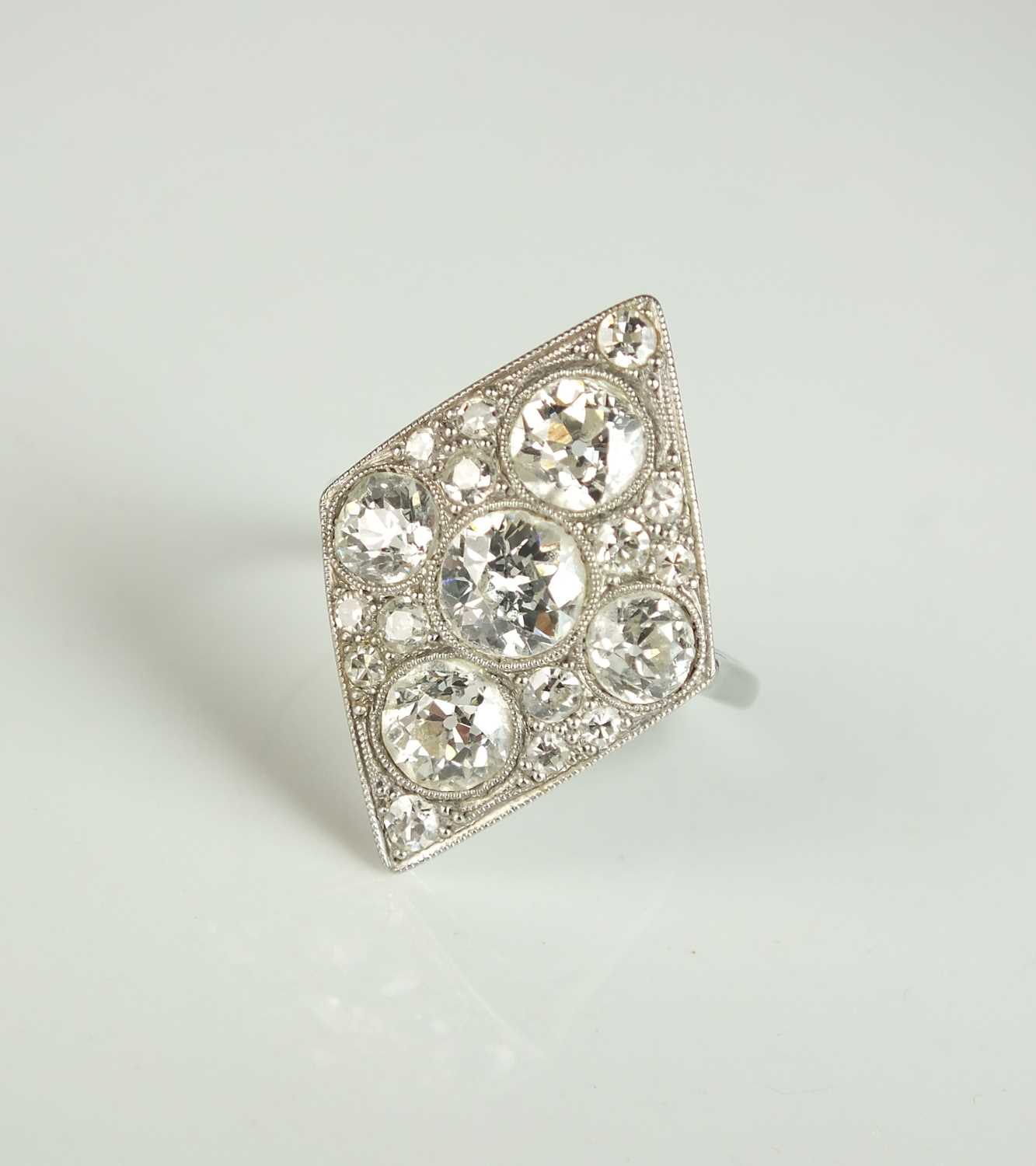 295 - An Art Deco diamond set plaque cluster ring