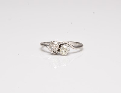 Lot 421 - A two stone old cushion cut diamond crossover ring