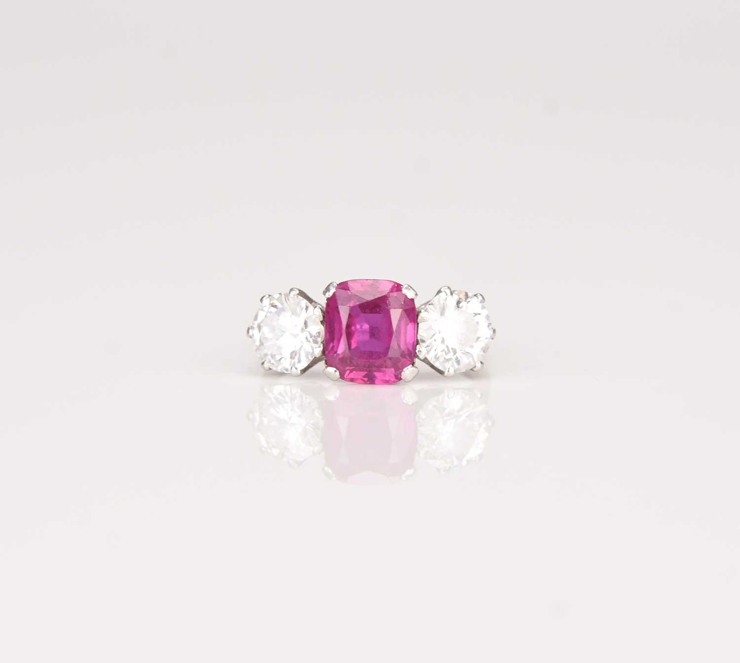 161 - A three stone ruby and diamond ring