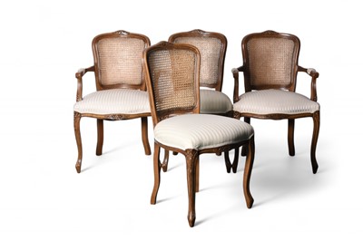 Lot 386 - A set of twenty Louis XV style walnut dining chairs
