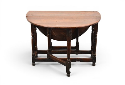 Lot 294 - A 17th century oak oval drop-leaf gateleg table