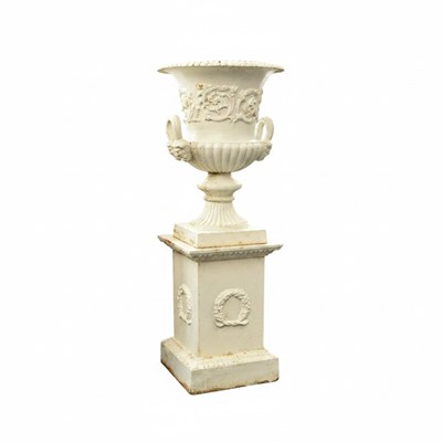 Lot 329 - A pair of Victorian cast iron urns on pedestals