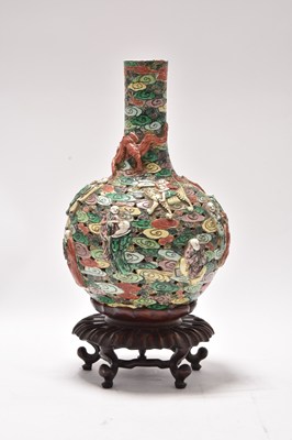 Lot 136 - A Chinese famille verte relief moulded bottle vase, Qianlong mark