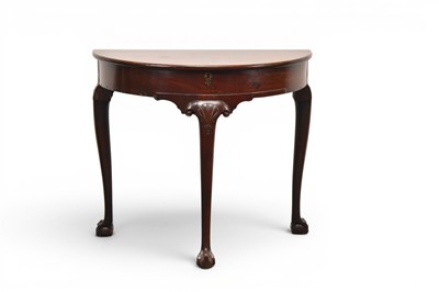 Lot 301 - A George III mahogany fold-over demi-lune table