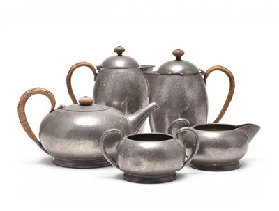 Lot 116 - A Liberty & Co five piece hammered English pewter tea service (5)